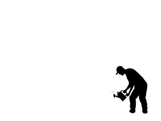 Obraz premium A person in casual attire kneeling while planting young seedlings in a garden, showcasing a nurturing spirit.