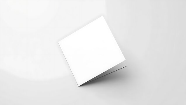 A blank white card is open and isolated on white background
