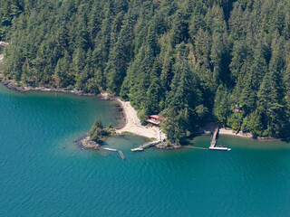 Aerial View of Green Forest and Beach Along the Canadian Coastline