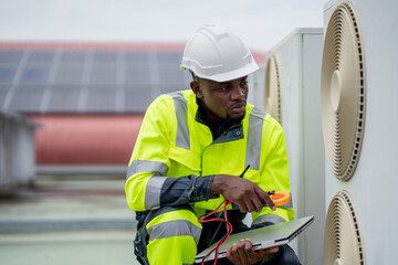 Engineers is checking the air conditioning cooling system of a major building or industrial...