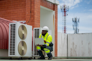 Engineers is checking the air conditioning cooling system of a major building or industrial...