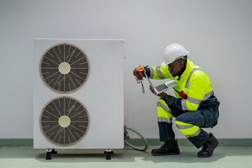 Engineers is checking the air conditioning cooling system of a major building or industrial...