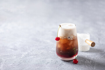 Cherry cola dirty soda in glass. Trending summer drink
