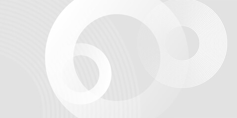 Abstract white geometric lines glowing on a gray background. Modern sparkling blue circle line pattern. Futuristic technology concept. Suitable for covers, posters, banners, headers, and websites.