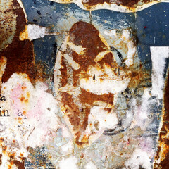 Close up abstract detail of old posters on building wall