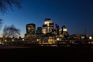TOWER BRIDGE, LONDON, UNITED KINGDOM - MARCH 28TH, 2025: London's skyline at night.
