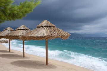 Fototapeta premium Beach parasols on sandy beach with scenic ocean under stormy sky
