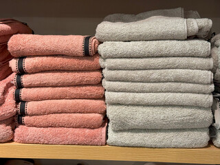 Stacked Multicolor Towels on Industrial Wooden Shelves,Pastel and Bold Textile Harmony