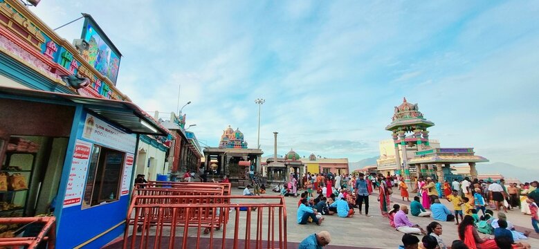 temple, sunset, crowd, walkway, shadows, people, architecture, religious place, sunlight, spiritual, outdoors, pilgrimage, traditional, culture, golden hour, public gathering, worship, travel, heritag