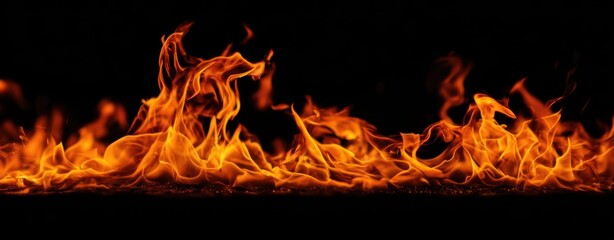 The vibrant flames of fire dancing against a dark backdrop