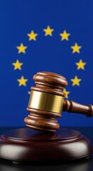 Wooden gavel resting on sounding block with European Union flag background judge justice