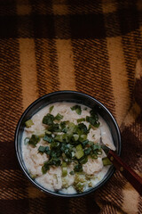 Bowl of Cheesy Pasta with Green Onions