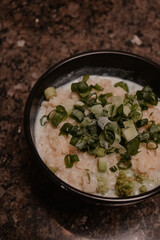 Bowl of Cheesy Pasta with Scallions