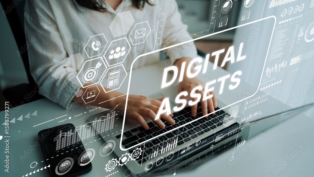 Poster hands typing on laptop with digital assets concept overlaid, featuring data visualizations and techn