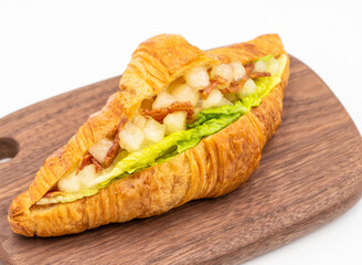 Gourmet Bacon Apple Croissant Savory Sweet Breakfast Pastry on Wooden Board side view of Sweet Breakfast