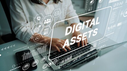 Hands Typing on Laptop with Digital Assets Concept overlaid, Featuring Data Visualizations and...