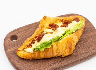 Bacon Egg Salad Croissant Savory Pastry on Wooden Board side view of Breakfast Dessert