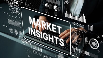Professional analysis of market insights with hands typing on a laptop surrounded by data...
