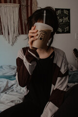 Woman Holding Iced Coffee Portrait Indoors