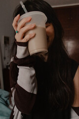 Woman Holding Iced Coffee Portrait