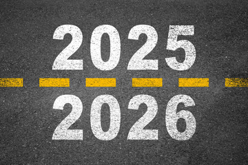 New year 2026 or straight forward concept. Text 2025, 2026, 2027, 2028 written on the road in the...