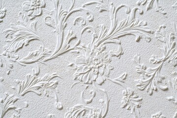 Delicate white embossed floral pattern showcasing intricate details on textured surface perfect for elegant decor or interior design inspiration