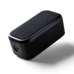 Obraz premium A generic, unbranded black compact portable speaker, isolated on a pure white background. Audio, travel.