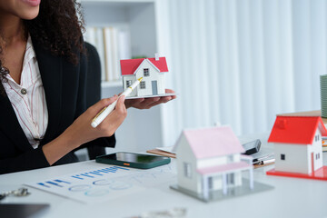 African American joyful attractive stylish young woman, freelancer, manager or real estate agent,...