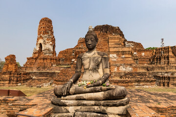 Fototapeta premium Buddha Statue in Wat Mahathat Temple Ayutthaya Historical Park, Ayutthaya, Thailand