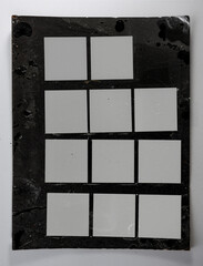 Analog medium format contact sheet with twelve 6x6 film negatives arranged in a grid on a black photographic background. 