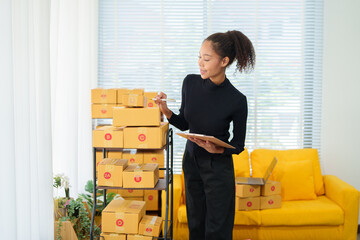 Pretty African American sme business woman working Custom Ecommerce Packaging leading supplier of...
