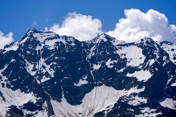 Scenic view of mountain panorama in the Swiss Alps seen from Lauchernalp hiking trail on a sunny...