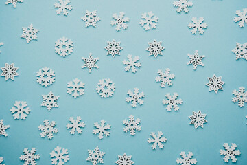 Snowflakes on blue background for christmas, seasonal greeting or holiday mockup concept
