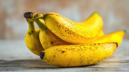 Small ripe bananas placed on a table, detailed close-up view