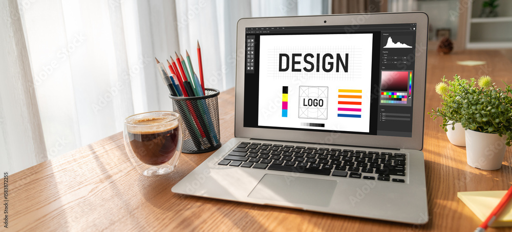 Poster graphic designer software for modern design of web page and commercial ads showing on the computer s