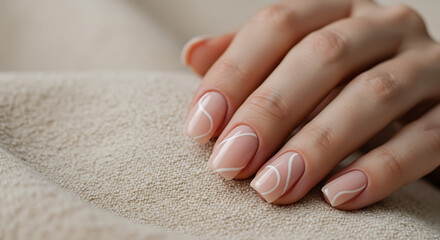 Soft pastel pink nails on short square nails, with minimalist white line design, resting on a linen fabric background