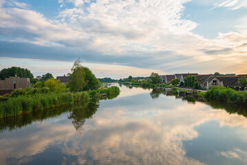Clouds are reflected in the calm waters of the river Rotte near Oud Verlaat, just north of...