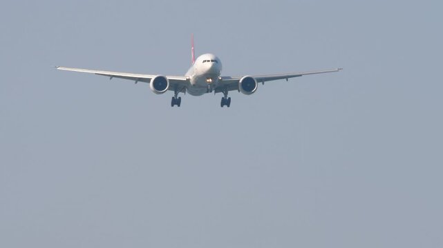 Commercial jet approaching. Shot, aircraft landing. Ideal for themes of travel, aviation, and plane spotting
