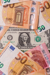 Paper money, euro and dollar bills, exchange rate fluctuations. Paper cash euros and dollars as a financial background