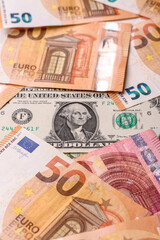 Paper money, euro and dollar bills, exchange rate fluctuations. Paper cash euros and dollars as a...