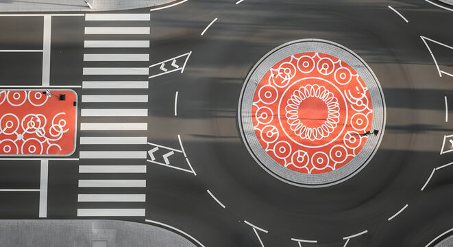 Urban Road Junction Featuring Unique Roundabout Art For Community Engagement - Powered by Adobe