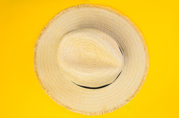 Women vintage hat top view isolated on bright yellow background summer fashion accessory
