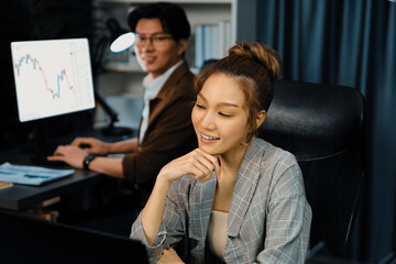 Successful smiling business partners earning high revenue in sales target online market in creative...