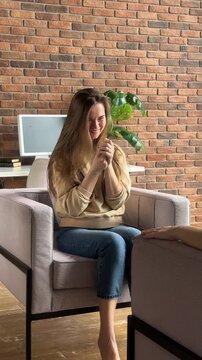 Woman smile and laugh sitting on armchair. Happiness, self-love, life balance, recovery.