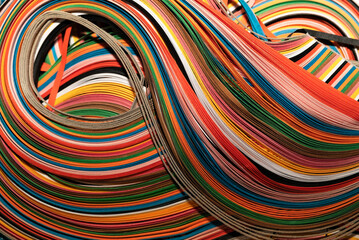 A vibrant close-up of multi coloured strips in flowing, waves. Perfect for abstract backgrounds,...