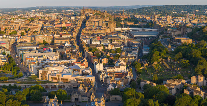 Aerial image of Edinburgh cityscape featuring Medieval Architectural buildings at Sunrise.