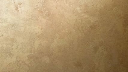 Metallic gold venetian plaster wall background, seamless stucco texture with elegant shine, rich...