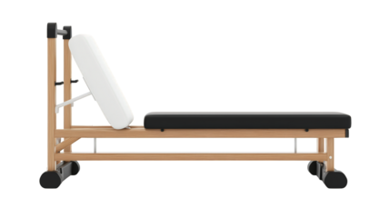 Wooden Pilates reformer with adjustable padded cushions and wheels for smooth exercise movements.