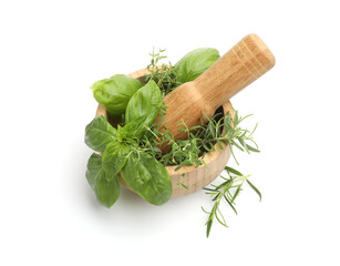 Mortar with pestle and different aromatic herbs isolated on white, above view