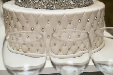 January 28, 2023 - Belgrade, Serbia. A three-tier birthday cake with silver decorations and the...